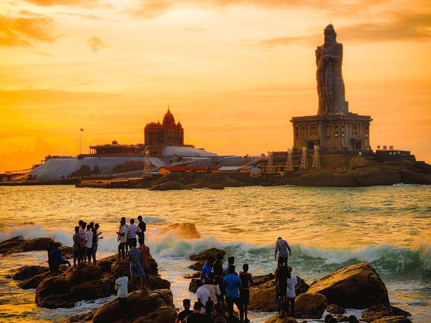 A captivating sunset view of the Vivekananda Rock Memorial and Thiruvalluvar Statue in Kanniyakumari, India.